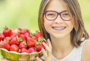 Girl Caring Strawberry